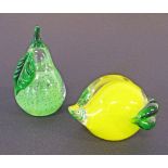 Two glass paperweights in the form of a pear and a lemon. (2)