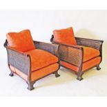 A pair of French style carved walnut and caned armchairs late 19th / early 20th century W70cm,