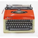 A Dutch Triumph Contessa de Luxe typewriter with orange cover, 33X32X10cm