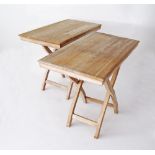 A pair of folding tables stained white, H75cm, 50X90cm. (2)