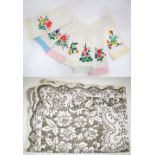 A set of seven linen embroidered bathroom napkins 35X70cm, together with a large lace tablecloth