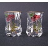 A pair of hand painted Bohemian liquor glasses, signed, H6cm. (2)