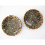 A pair of Chinese cloisonné dishes decorated in the mille fiori pattern, the backs in blue enamel,