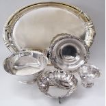 A collection of silver plated serving dishes and bowls. The largest 50X34cm. (5)