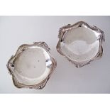 A pair of silver bowls, the hexagonal serpentine rim with moustache decoration, hallmarked 800,