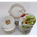 A collection of French porcelain dishes, 11 for fish marked Sarraguemines W28cm, 16 for salad