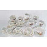 A collection of miscellaneous French porcelain tea & coffee cups, saucers and a creamer. (25)