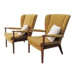 Parker Knoll - A pair of wingback open armchairs, c1960s, upholstered in mustard yellow fabric,