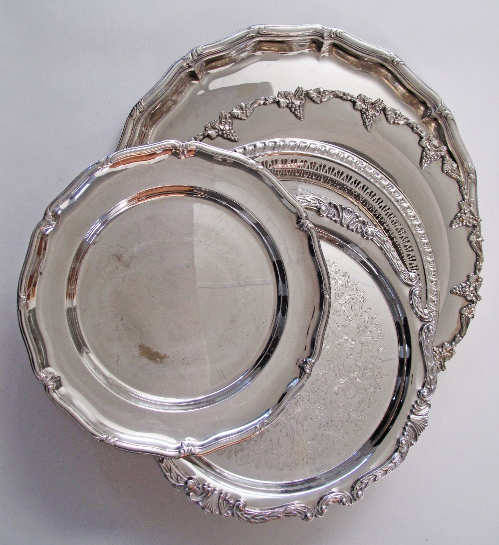 A collection of five silver plated round dinner serving dishes, with gadrooned rims, ranging from