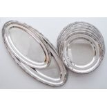 A set of nine silver plated serving dishes, seven round and two oval, all of plain oval or round