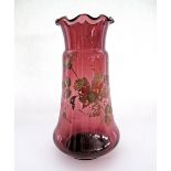 A Bohemian hand painted red glass vase with a frilled mouth. H26cm.