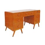 Vintage Retro 1950s/1960s Beech seven drawer twin pedestal kneehole desk on splay legs. W135cm,