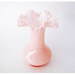 A Victorian c1900 pink opaline vase with a frilled rim. H20cm