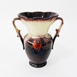 A West German pottery aubergine & orange flambe vase mid century, marked underneath 425/27 H23cm.