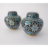 A pair of Chinese cloisonné lidded jars decorated in blue and white, mid 20th century. H8,5cm. (4)
