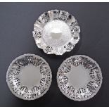 Three silver plated bonbon dishes with reticulated rims, one Canadian W16cm and a pair of German