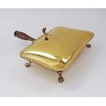 A brass silent butler Crumb catcher with wooden handle and a crest engraved to the top. W19cm, L25cm