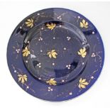 A Large French Opaque de Sarreguemines ceramic plate hand decorated with cobalt blue and gold leafs.