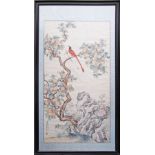 A Chinese watercolour on silk, depicting two colourful exotic birds on a peach tree, signed and