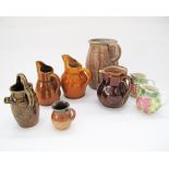 A collection of French stoneware pitchers, the tallest H23cm. (8)