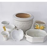 A collection of French ceramic and porcelain jardinieres, vases and pots, the largest H22cm. (7)