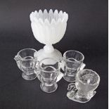 A collection of four glass egg holder cups in the form of chicken together with a large opaline