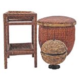 A collection of woven wicker baskets and stand. The large basket H44cm, W48cm. (3)