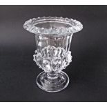 A pressed clear glass urn shaped footed vase H21cm.
