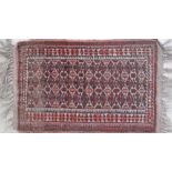 A small Anatolian carpet / mat with geometric motifs. 70X40cm