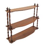 A French walnut three tier étagère, with turned supports, c19th century, H50cm, W58cm.