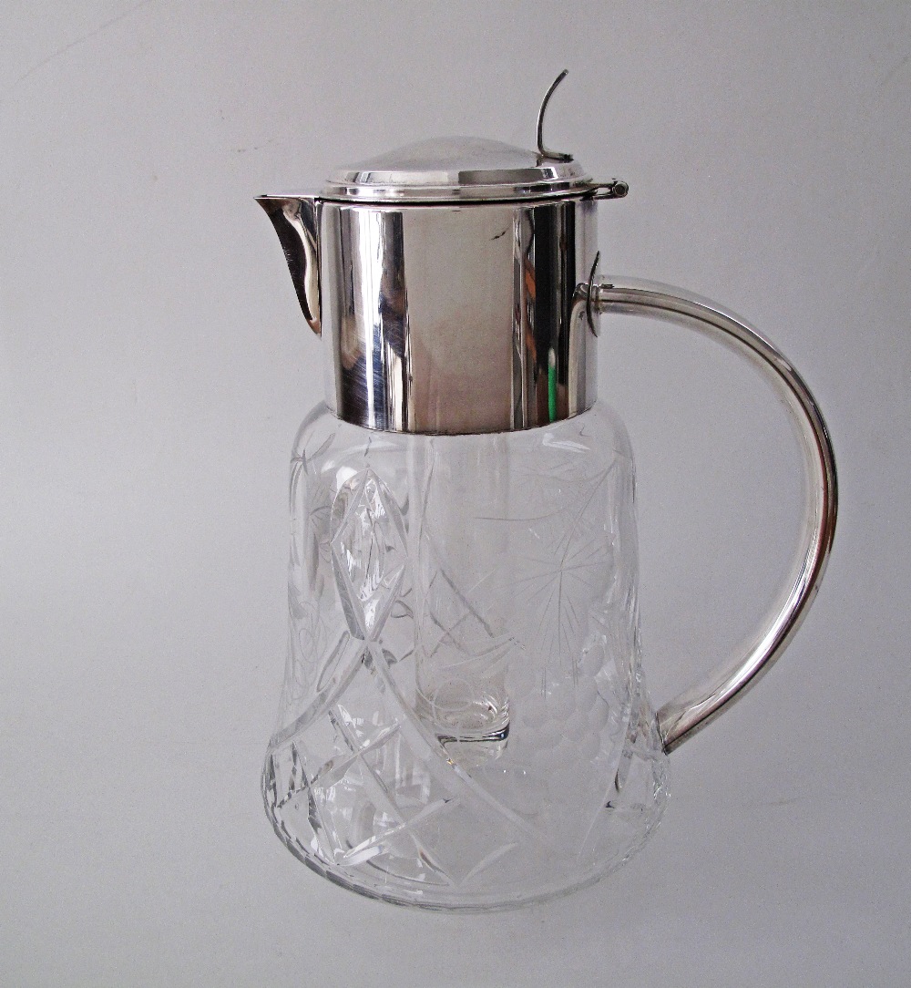 A German Wilhelm Wolff silver plated mounted crystal pitcher / claret jug, carved and engraved