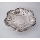 An Italian silver fruit bowl / bread basket, the gadrooned serpentine rim with foliage, Hallmarked