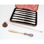 A boxed set of silver plated butter knives together with a silver paper knife hallmarked ST800,