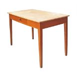 A Cypriot stained pine and beech laminated desk / work table on square tapering legs with one frieze