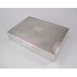 A sterling silver cigarette box Hallmarked Birmingham 1948 by Harman Bros the lid Guilloche /