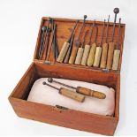 A set of 19 rose making tools and a pillow in a wooden box. The box W38cm.