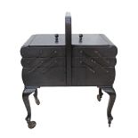 A German OPAL Kleinmobel 1960s ebonised beechwood sewing box / table / trolley, with handle, on