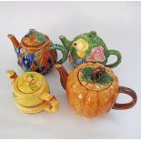 A collection of four ceramic tea pots. (8)