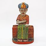 An Asian coloured wood carving of an Egyptian .