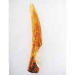 A Tribal African ivory tusk carved with a head