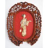 Japanese oval panel mounted in red silk overlaid with ivory and mother of pearl