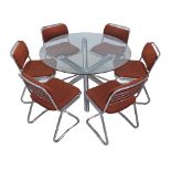 A tubular steel and glass dining table with six cantilevered tubular steel chairs