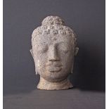 An Asian stone head of a Buddha