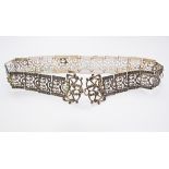 A women's silver chain belt