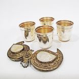 Silver plated beakers and a white metal and mother of pearl belt buckle