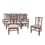 A set of 14 Chippendale style carved mahogany dining chairs