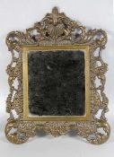 Bronze-SpiegelSpiegel mit Bronzerahmen, dieser mit durchbrochenem Rocaillendekor, H. 34, L. 26