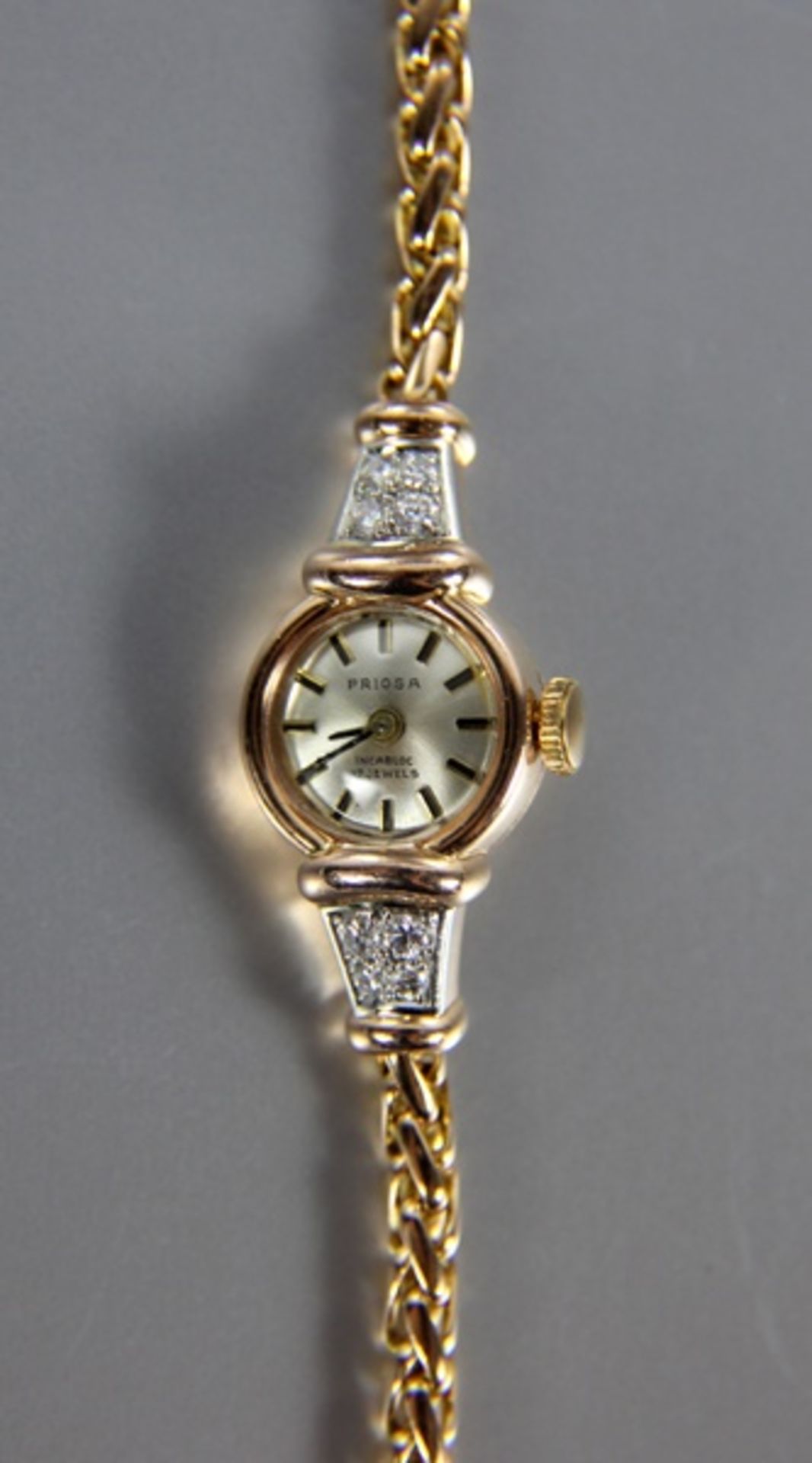Damenarmbanduhr585er RG, Priosa-Damenarmbanduhr, mit 4 Diamanten in versch. Größen, rundes