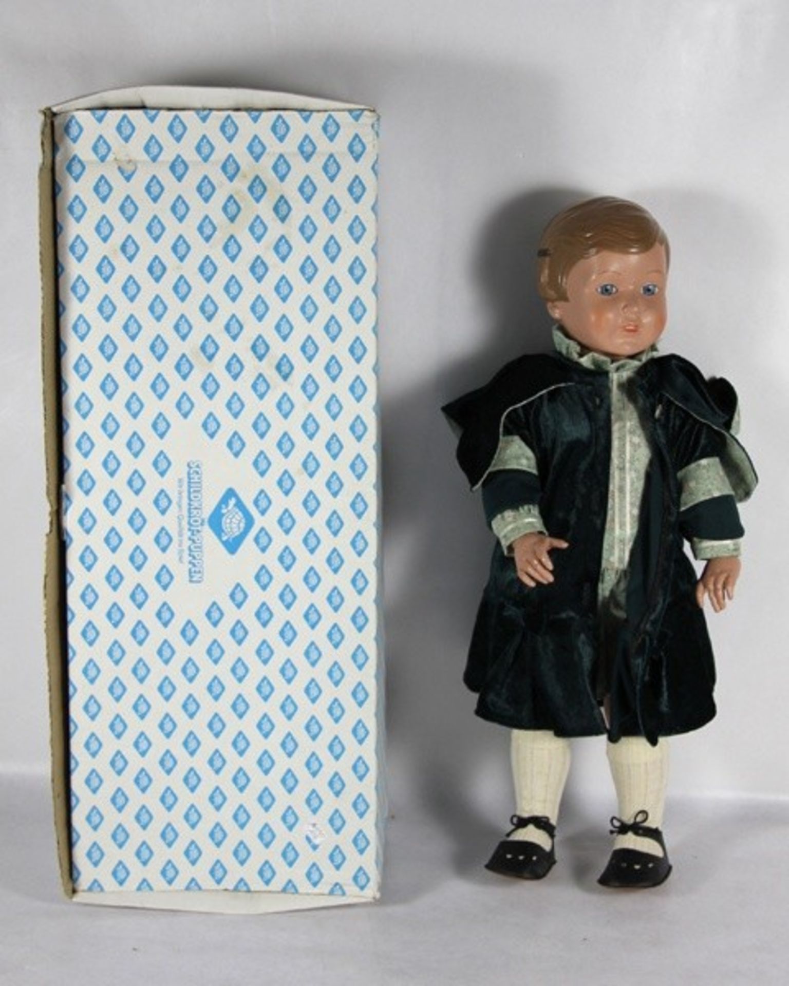Schildkröt-PuppeSchildkröt-Puppe, gegossenes Haar, blaue Augen, gemarkt, H. 51, in Originalkarton,
