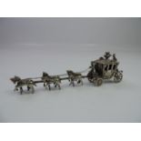 A Dutch Silver Miniature Royal Coach with Driver and Rear Guard, Crown Finial to the Roof and a Team